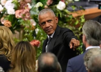 Former President Barack Obama gestures to Gavin Newsom at the funeral for Rev. Jesse Jackson at the House of Hope in Chicago, Friday