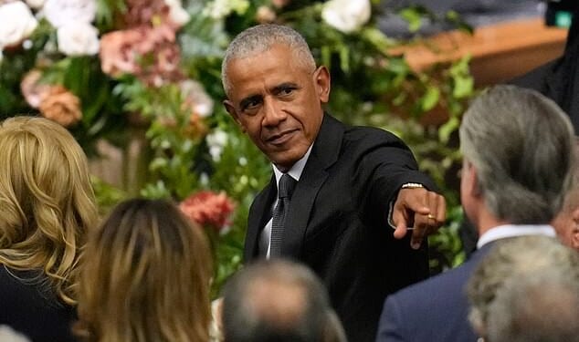 Former President Barack Obama gestures to Gavin Newsom at the funeral for Rev. Jesse Jackson at the House of Hope in Chicago, Friday