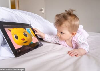 Parents have been told to limit screen time to an hour a day for under-fives and keep them off AI and social media – under new Government guidelines (file picture)
