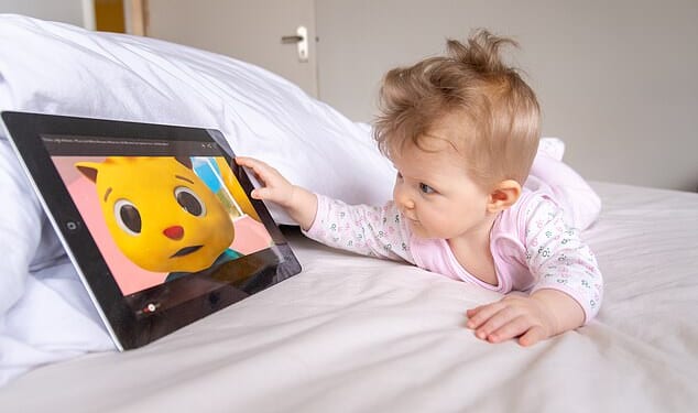 Parents have been told to limit screen time to an hour a day for under-fives and keep them off AI and social media – under new Government guidelines (file picture)
