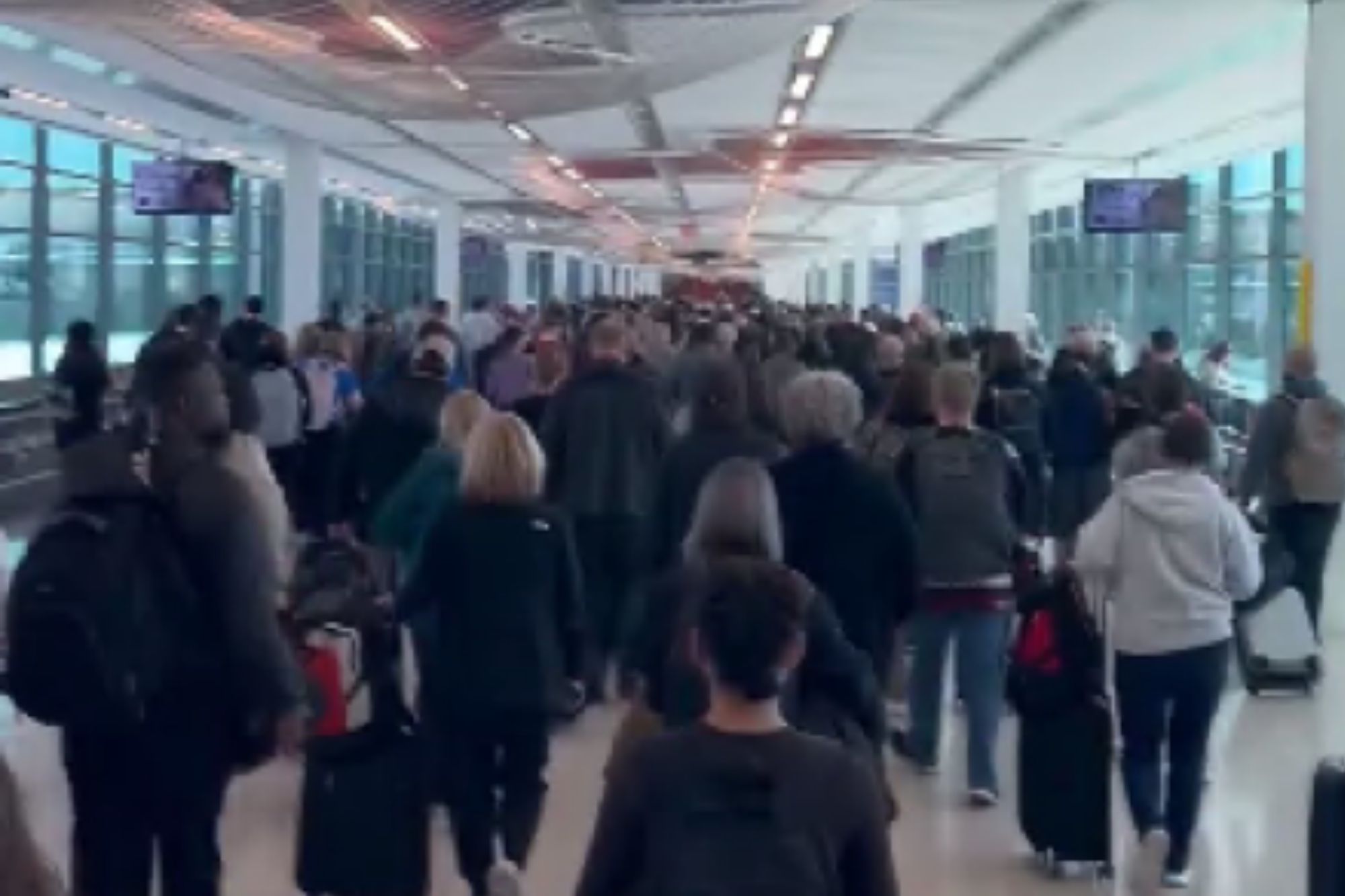An image collage containing 1 images, Image 1 shows People walking in an airport terminal