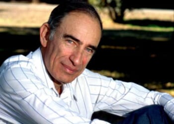 Paul Ehrlich pictured sitting down in field on April 5, 1993.