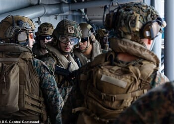 Officials said that the Pentagon is preparing for weeks of ground operations in Iran just shy of a full-scale invasion. Pictured: Sailors and Marine who arrived in the Middle East on Friday