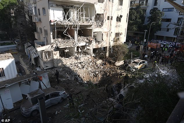 A building was reduced to rubble after missile strikes hit Tel Aviv on March 24