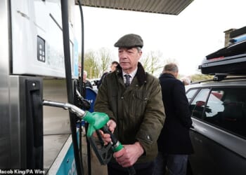 Nigel Farage helped motorists at a garage in Buxton today as he demanded the government halts planned fuel duty rises