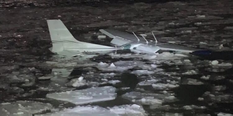 Plane crashes into Hudson River during emergency landing as pilot and passenger swim through icy waters to safety
