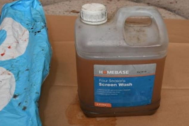 The father-of-four smashed his way in through the conservatory before pouring petrol around the foot of the staircase of the country home. Pictured: The container of fuel later found in Brooks's bike pannier