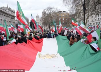 A Stage for Freedom demonstration against the Iranian government will march from Whitehall to Kensington Road near Hyde Park in Knightsbridge, close to where the nation's embassy is situated. Pictured: Protesters outside Parliament on February 28