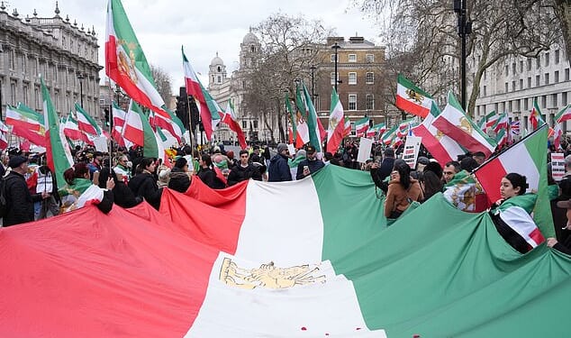 A Stage for Freedom demonstration against the Iranian government will march from Whitehall to Kensington Road near Hyde Park in Knightsbridge, close to where the nation's embassy is situated. Pictured: Protesters outside Parliament on February 28