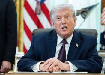 President Donald Trump sits at the Resolute Desk on Tuesday. White House press secretary Karoline Leavitt said Tuesday night that the President will give an 'Address to the Nation' Wednesday at 9 p.m. ET to give an update on Iran