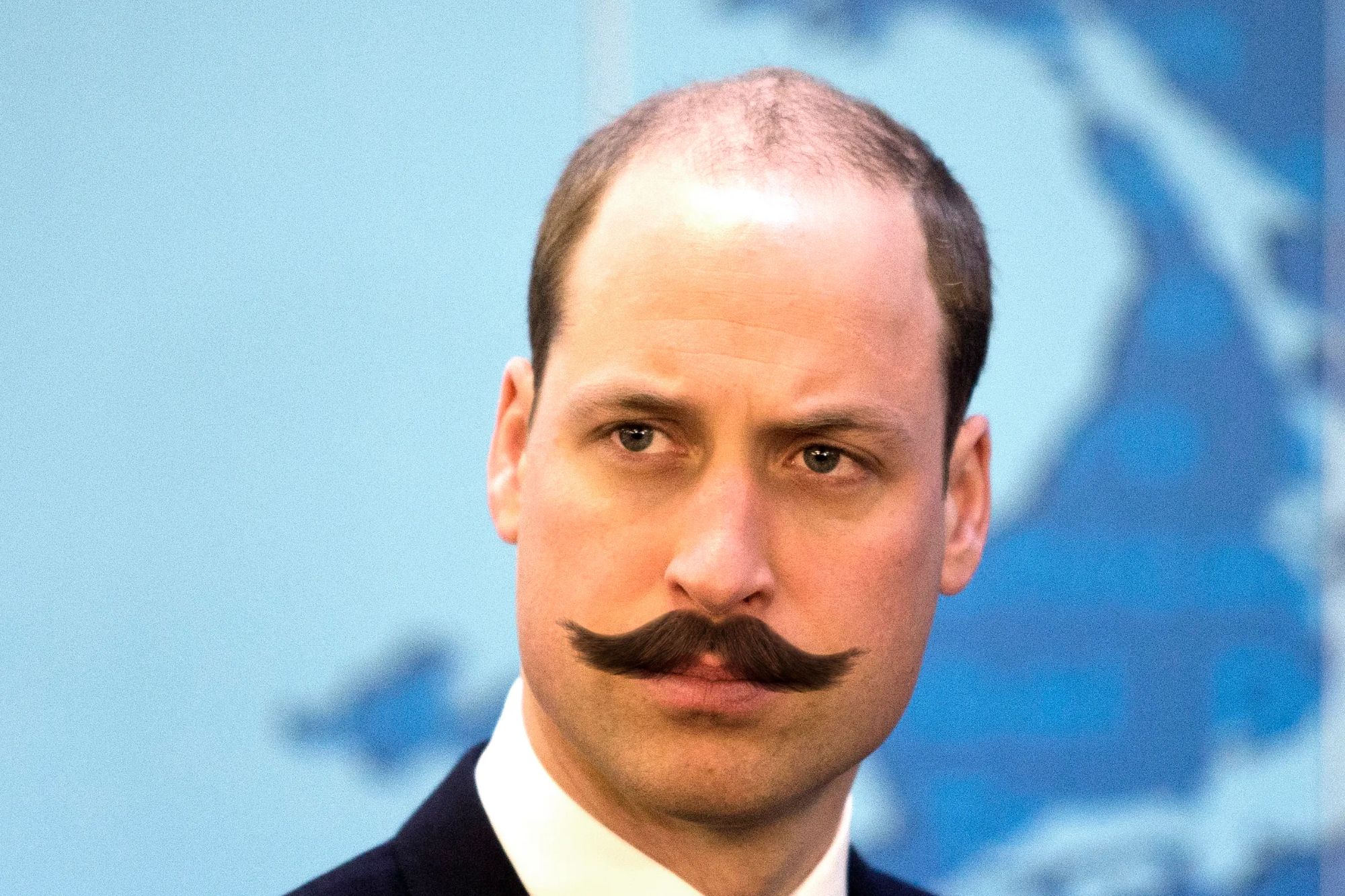 An image collage containing 1 images, Image 1 shows Prince William with a large, dark mustache