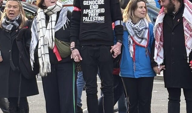 Thomas Abdullah Bourne (centre), 39, an Islamic convert who uses the social media handle 'White British Muslim', followed the Jewish comedian, 51, as he rode the elevator on the Tube