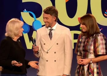 Queen Camilla said she thinks it's so important that children keep on reading and writing (pictured: Queen Camilla (L) with Alex Jones (R) and Roman Kemp (M))