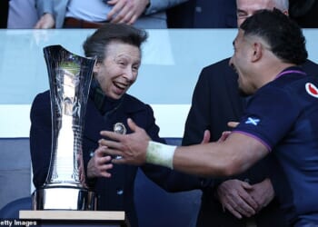 When Sione Tuipulotu approached Anne, the pair both mirrored each other by opening their arms in jest - a humorous reference to their previous encounter last month in which the rugby star attempted to hug the royal