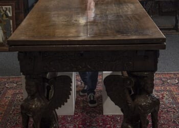 Paul Fitzsimmons pictured with the Elizabethan era table which sold for £126,000