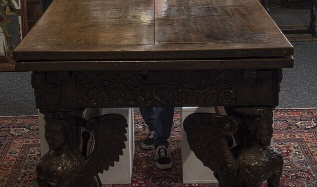 Paul Fitzsimmons pictured with the Elizabethan era table which sold for £126,000