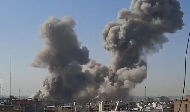 Smoke billowing into the sky above Khamenei's compound on Pasteur Street in the heart of Tehran