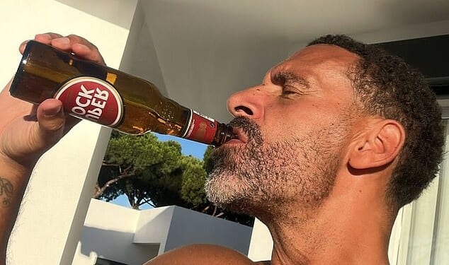 On Saturday Rio Ferdinand posted a picture of himself bare-chested on his socials, sipping a bottle of Portuguese Super Bock beer on a sun kissed terrace and wrote: ‘That feeling when Liverpool + Chelsea drop points in the race for the top 4’