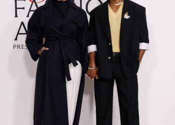 The woman accused of shooting at Rihanna's home while she and her family were inside was hit with multiple charges, including for attempted murder, on Tuesday; Rihanna and partner ASAP Rocky are pictured in November in NYC