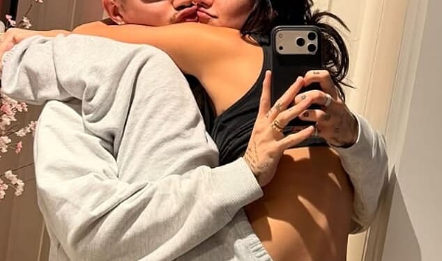 Romeo Beckham couldn't keep his hands off his stunning girlfriend Kim Turnbull as he shared a very loved-up photo on Instagram celebrating International Women¿s Day