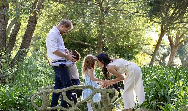 Prince Harry pictured with Meghan Markle and children Archie and Lilibet in December. Friends yesterday claimed he wants the King to invite his family to stay in Norfolk this summer