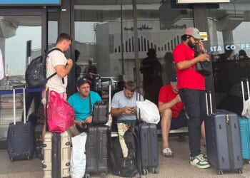 Rush to escape Dubai by bus, taxi and jet: Chaos and gruelling 16-hour journeys across the desert - while the wealthy fight for spots on £143k private jet flights