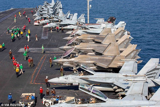 Aircraft attached to Carrier Air Wing (CVW) 9 sit on the flight deck of the U.S. Navy Nimitz-class aircraft carrier USS Abraham Lincoln in support of the Operation Epic Fury attack on Iran, February 28