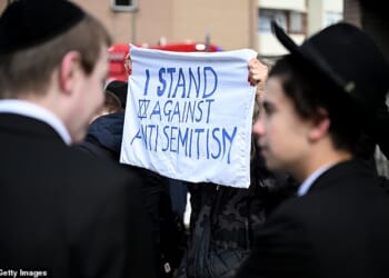 Member of the Jewish community take to the streets after the arson attack on ambulances run by the Jewish charity Hatzola Northwest