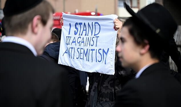 Member of the Jewish community take to the streets after the arson attack on ambulances run by the Jewish charity Hatzola Northwest