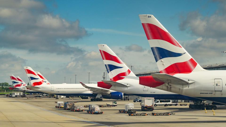 Tail fins of British Airways jets at Terminal 5, London Heathrow Airport.