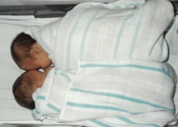 Sasha and her twin sister (above) were implanted in the wrong mother as IVF embryos