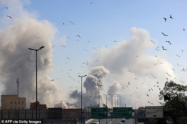 Smoke rises over Tehran on Thursday after another wave of Israeli bombardment