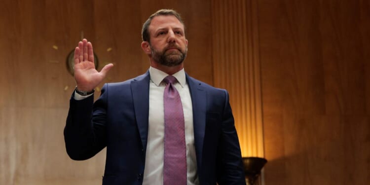 U.S. Sen. Markwayne Mullin (R-OK) is sworn in before testifying in the Dirksen Senate Office Building on March 18, 2026 in Washington, DC.