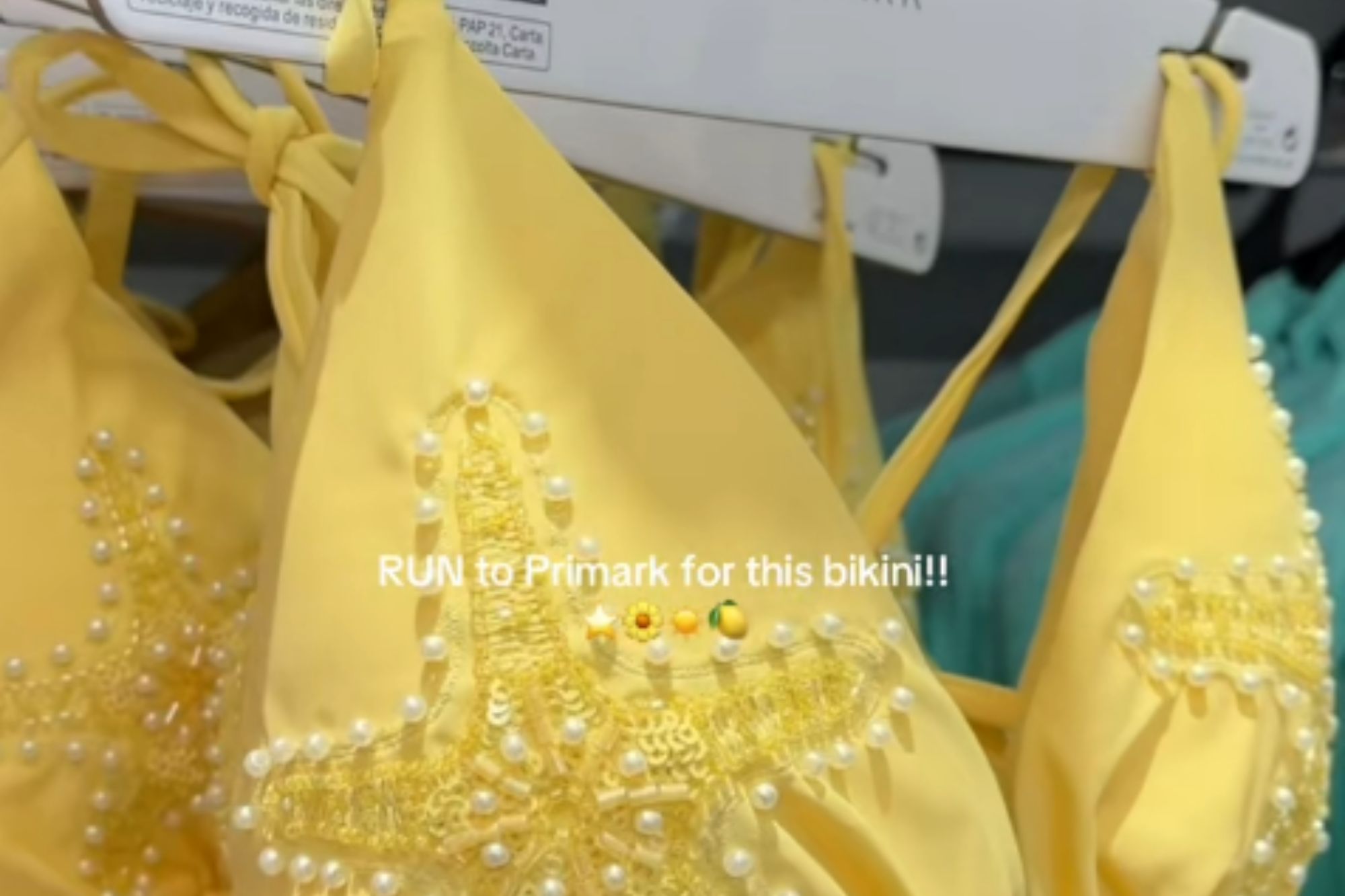 An image collage containing 1 images, Image 1 shows A yellow bikini top with pearl and sequin starfish embroidery, hanging on a Primark clothes hanger