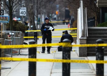 Toronto Police officers work around the scene of a shooting Tuesday at the U.S. Consulate in Toronto, Canada, days after Middle East war protests outside the building. No one was injured, police said,.