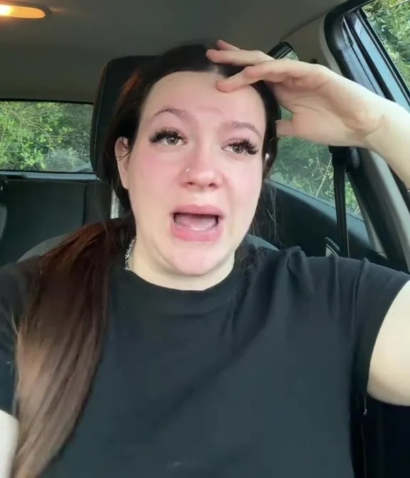 A crying, pregnant woman with a distressed expression in a car with text overlay "BEING MADE HOMELESS AT ALMOST 8 MONTHS PREGNANT."