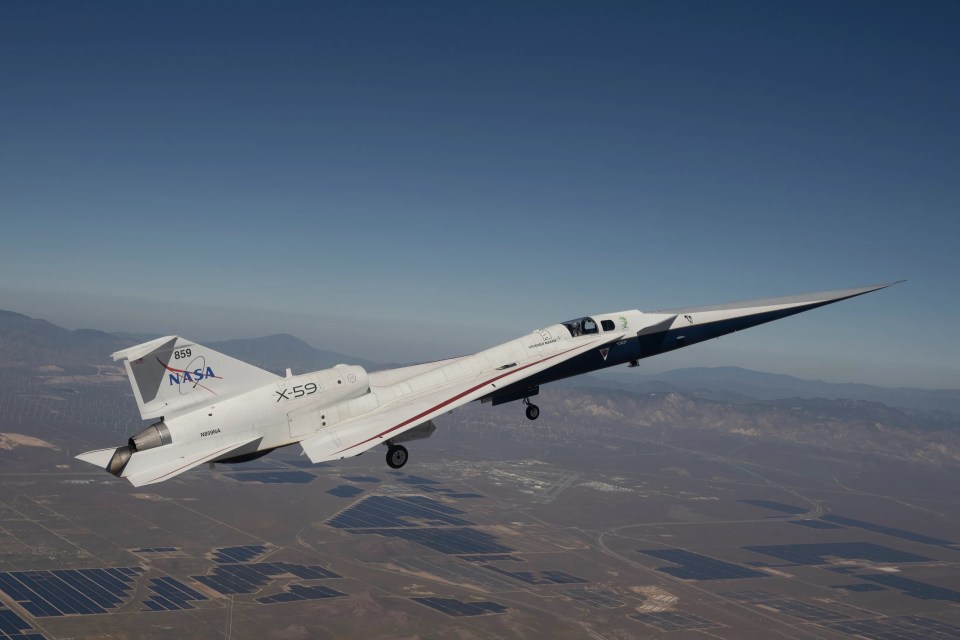NASA's X-59 Experimental Supersonic Aircraft flying above solar panels and wind turbines.