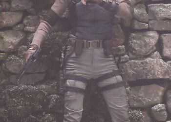 Sophie Turner threw herself into character Lara Croft on Monday as she wielded two guns while shooting dramatic Tomb Raider action scenes in Surrey