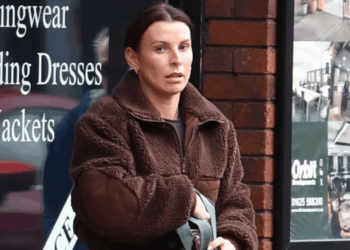 Stony-faced Coleen spotted after 'worse for wear' husband Wayne Rooney parties with two mystery women before Brits