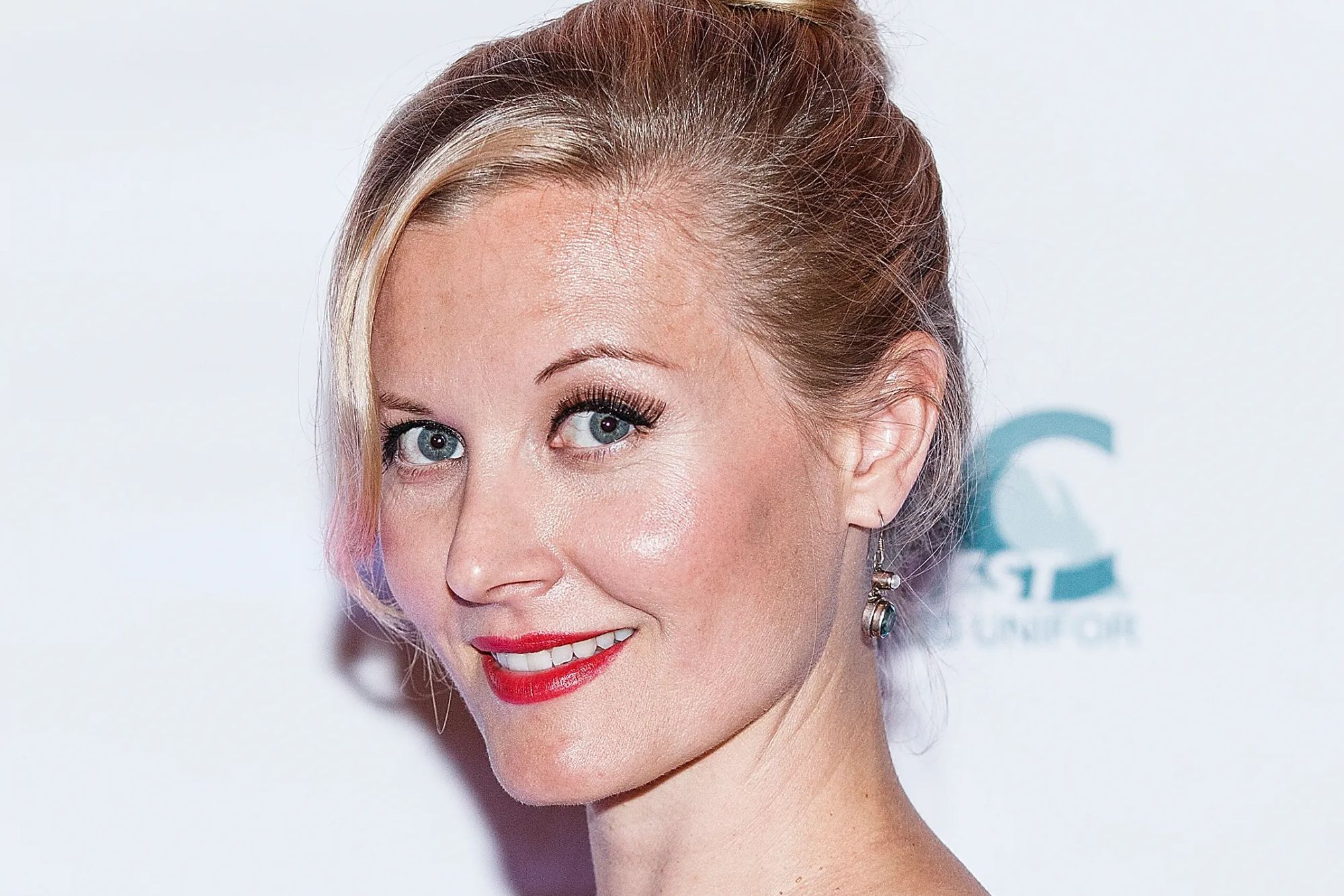 An image collage containing 1 images, Image 1 shows Actress Carrie Fleming smiling at the 2014 Leo Awards Gala