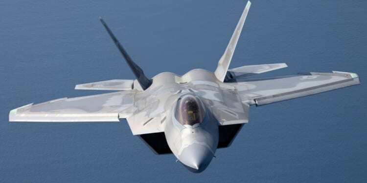 A U.S. F-22 Raptor is seen in a stock photo flying over the Pacific Ocean. Spain has closed its airspace to U.S. planes involved in the Iran war.