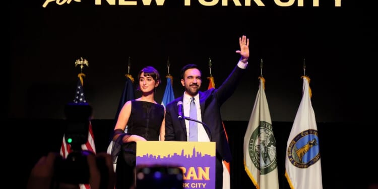 New York City Democratic Mayor Zohran Mamdani waves with his wife, Rama Duwaji, after delivering remarks at his election night watch party at the Brooklyn Paramount on Nov. 4, 2025, in the Brooklyn borough of New York City.