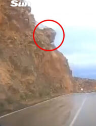 Terrifying moment sudden landslide buries car as huge rocks fall from hillside