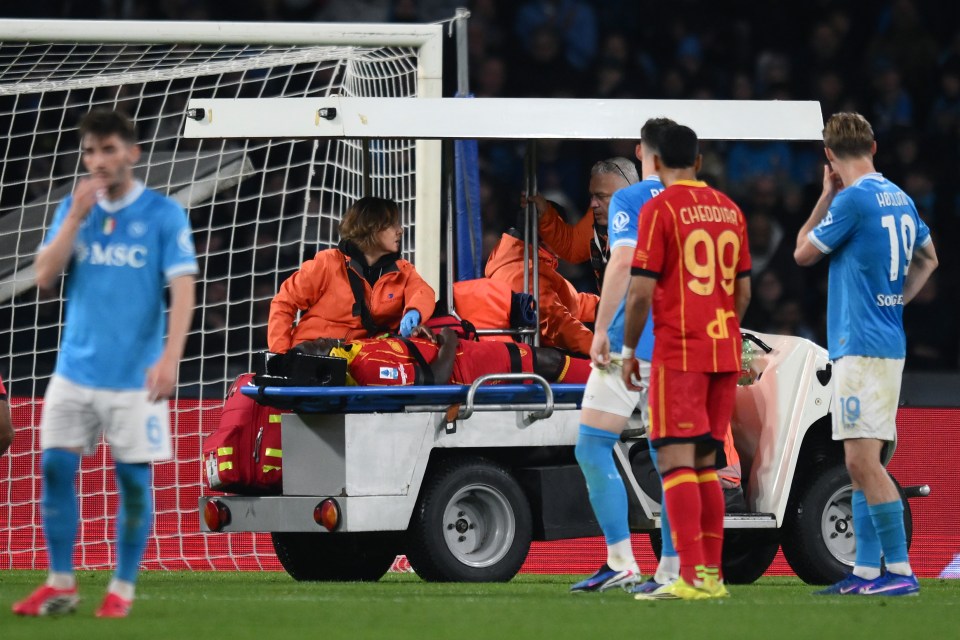 Lameck Banda of Lecce being transported on a stretcher cart during a Serie A match.