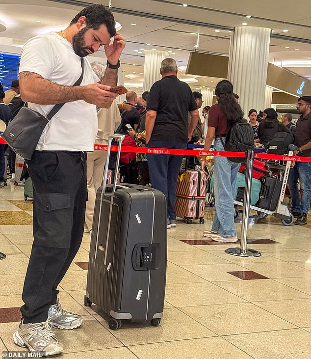 Passengers in the terminal at Dubai Airport this morning as flights are still being affected
