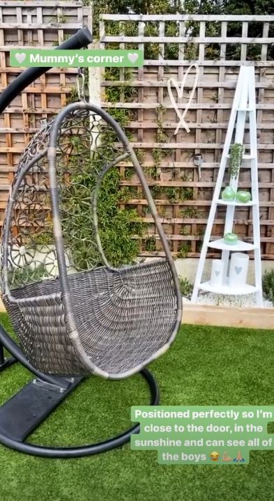Stacey Solomon's "Mummy's corner" in her garden, featuring a hanging egg chair and a white corner shelf.