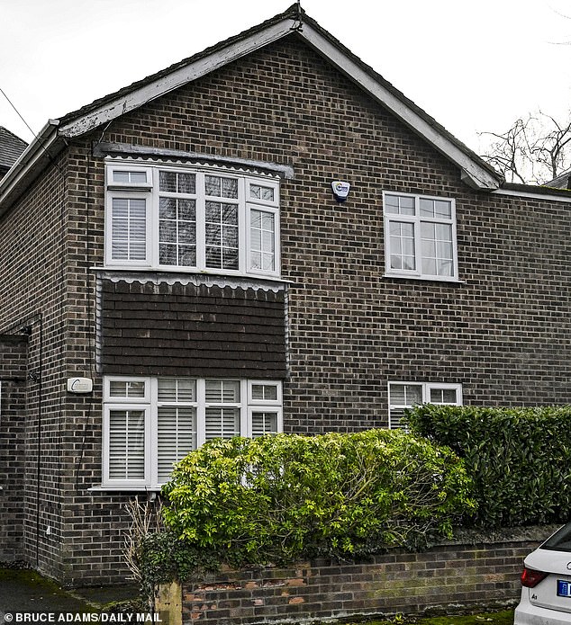 There is nothing out of the ordinary about Carl Jones's quaint home (pictured) in the heart of suburban Manchester