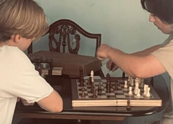 Angela Shellis was a doting mother who was happiest when she was at home with 'my boys' - her 18-year old son Tristan Roberts (right) and his brother Ethan, seen here playing chess