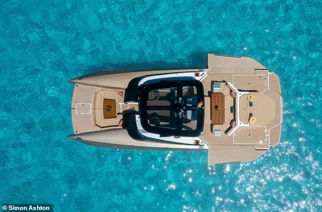 One of the yachts that Domenique rents out to his clients floats on the shimmering azure sea