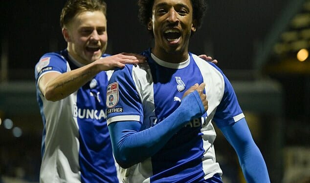 Oldham's Kane Drummond celebrates scoring his side's early goal against Notts County. The Latics ran out 3-0 winners and are flying towards the League Two play-offs